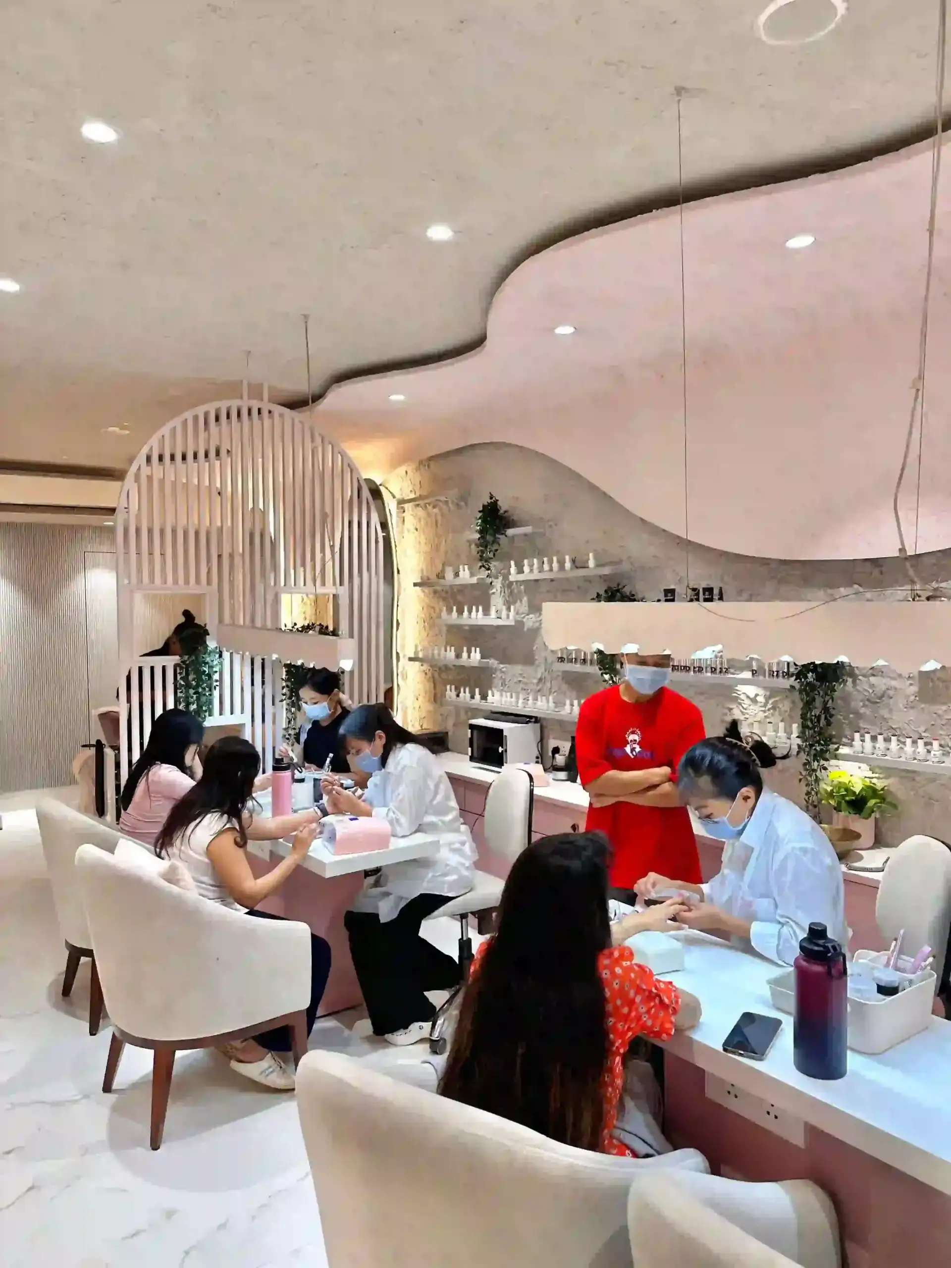 Clients enjoying treatments inside Bellissimo Nail Studio, Khar West
