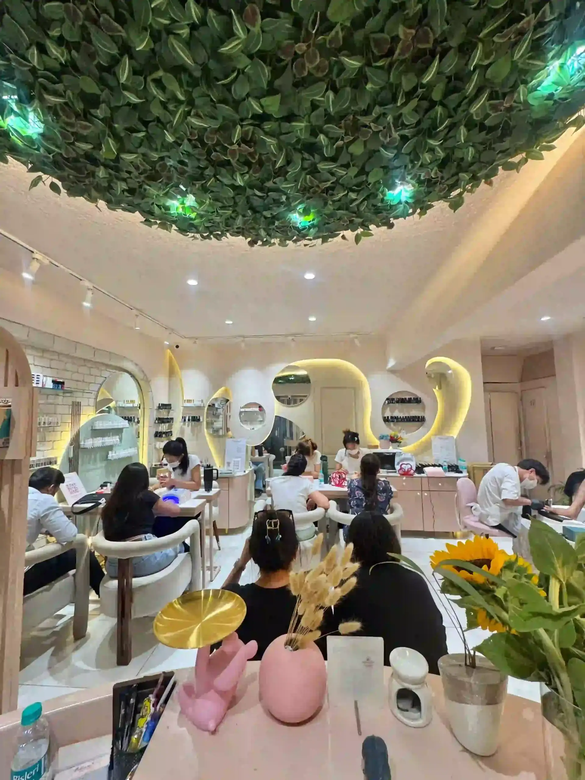 Bellissimo Nail Studio interior with clients